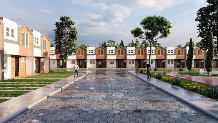 Calle principal del Condominio Córdoba con casas de dos niveles y jardines