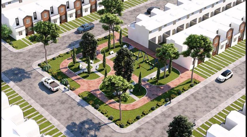 Vista aérea del área verde central con juegos y caminamientos